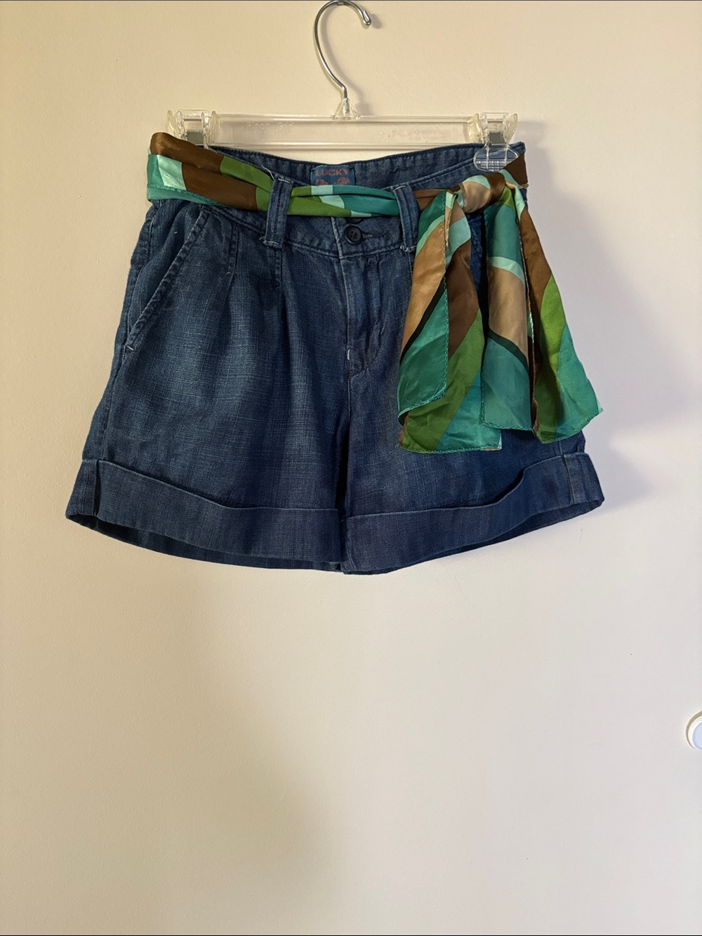 Lucky Brand Denim Cuffed Shorts with matching belt and teal/brown/green scarf.